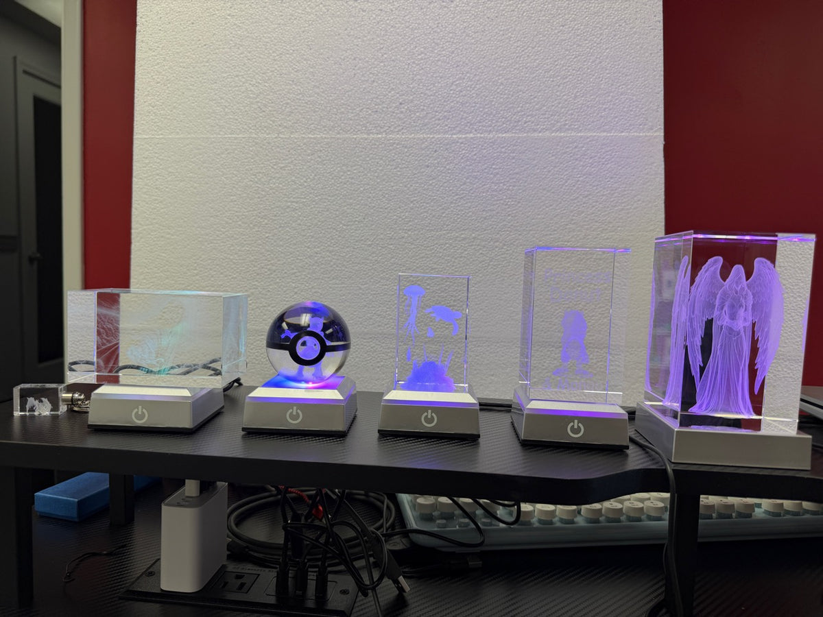 Full lineup of custom crystal keychain, rectangular keepsakes and sphere with LED display bases