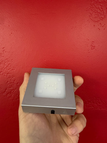 Large silver LED crystal base showing its side power port and control