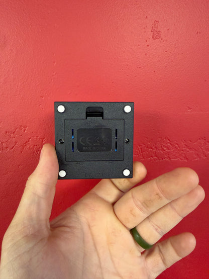 Bottom of small LED crystal base showing battery compartment and non-slip feet