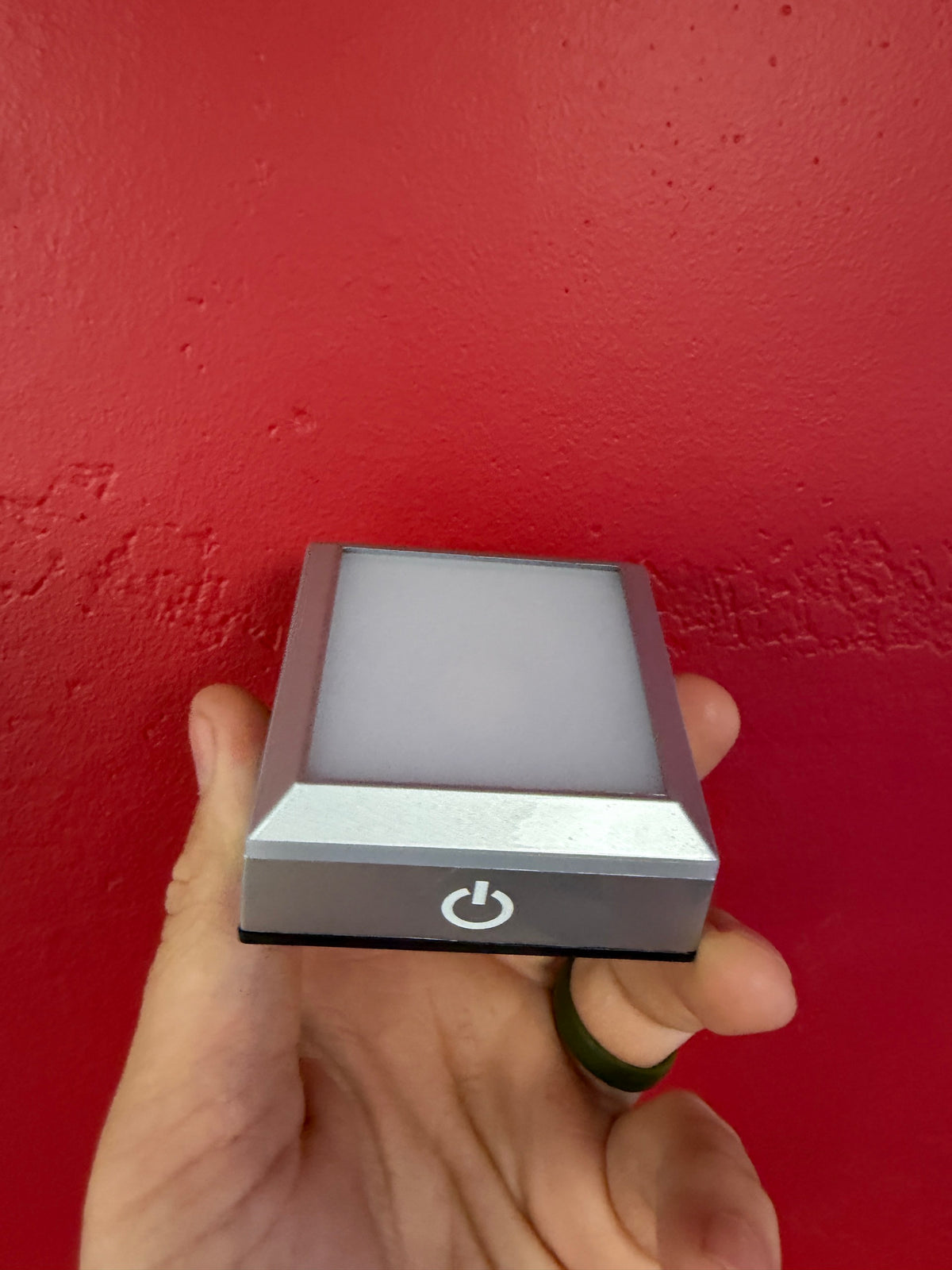 Small 68 x 68 x 30 mm silver LED crystal display base with front power button